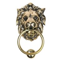 The Aged Brass Traditional Lion"s Head Front Door Knocker on a White Background The Aged Brass Traditional Lion"s Head Front Door Knocker on a White Background