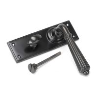 The Aged Bronze Classic Fluted Period Privacy Suite Bathroom Lever Handles Shown on its Side The Aged Bronze Classic Fluted Period Privacy Suite Bathroom Lever Handles Shown on its Side