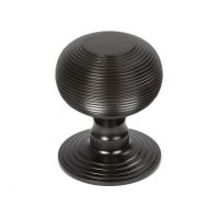 The Aged Bronze Traditional Beehive Centre Door Knob Shown Upright on a White Background The Aged Bronze Traditional Beehive Centre Door Knob Shown Upright on a White Background