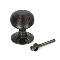 The Aged Bronze Traditional Beehive Centre Door Knob Shown with Bolt on a White Background The Aged Bronze Traditional Beehive Centre Door Knob Shown with Bolt on a White Background