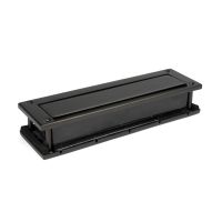 The Aged Bronze Traditional Sleeved Door Letterbox Set Facing the Exterior Plate The Aged Bronze Traditional Sleeved Door Letterbox Set Facing the Exterior Plate