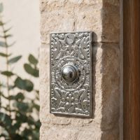The “Anderson” Bright Chrome Rectangle Pattern Bell Push on a Sunny Stone Wall on a Family Home - Digital Illustration The “Anderson” Bright Chrome Rectangle Pattern Bell Push on a Sunny Stone Wall on a Family Home - Digital Illustration