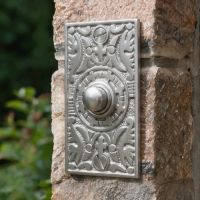 The “Anderson” Satin Chrome Rectangle Pattern Bell Push on A Brick Stone Wall at a House Entrance - Digital Illustration The “Anderson” Satin Chrome Rectangle Pattern Bell Push on A Brick Stone Wall at a House Entrance - Digital Illustration