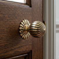 The Antique Brass Round Flowered Mortice Knob Set Mounted on a Wooden Stained Door - Digital Illustration jpg The Antique Brass Round Flowered Mortice Knob Set Mounted on a Wooden Stained Door - Digital Illustration jpg