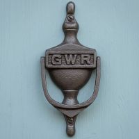 The Antique Iron "GWR" Urn Door Knocker  on a Blue Timber Door on a Period Home - Digital Illustration