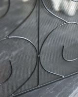 Close Up Of "The Antiquitas" Three Fold Fire Guard Scroll Detailing Close Up Of "The Antiquitas" Three Fold Fire Guard Scroll Detailing