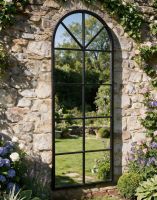 The Arched Garden Mirror with a Black Frame Mounted on a Traditional Stone Garden Wall - Digital Illustration