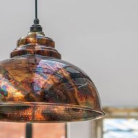 The Arcus Spun Pendant Light in Burnished Finish Shown Close Up in a modern Home 