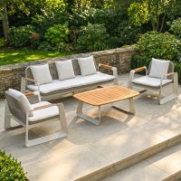 The Arcus Woven Rope Lounge Suite Shown on a Raised Patio in a Sunny Garden Nook