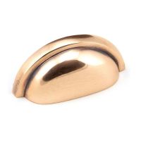The Art Deco Concealed Cup Drawer Pull in Polished Bronze on a White Background 