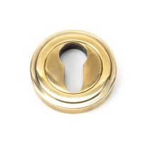 The Art Deco Concealed Standard Euro Escutcheon - Aged Brass on a White Background 