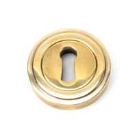 The Art Deco Concealed Standard Keyhole Escutcheon - Aged Brass on a White Background The Art Deco Concealed Standard Keyhole Escutcheon - Aged Brass on a White Background