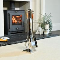 The "Ashcombe" Stainless Steel Companion Set with Hardwood Handles in Front of a Modern Fireplace  - Digital Illustration 