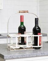 The ‘Avignon’ Wine Carrier or Wine Holder in a Cream Finish Holding Wine Bottles on a Kitchen Counter Top - Digital Illustration The ‘Avignon’ Wine Carrier or Wine Holder in a Cream Finish Holding Wine Bottles on a Kitchen Counter Top - Digital Illustration