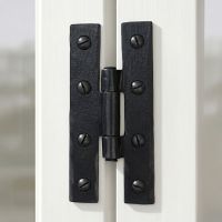 The Black 3¼" Inch H Hinge Pair Mounted on the Inside of a White Wooden Window Frame - Digital Illustration