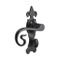 The Black Antique Fleur-de-Lis Bathroom Door Handles - Ornate Monkey Tail Privacy Pair on a White Background
