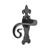 The Black Antique Fleur-de-Lis Door Handles - Ornate Monkey Tail Lever on a White Background
