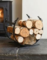 The Black Blacksmith Curved Log Rack on a black Stone Hearth by a Log Burner Stove - Digital Illustration 