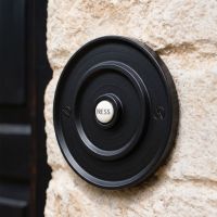 The Black Classical Round Push Door Bell on a White Wall next to a Classic Front Door - Digital Illustration The Black Classical Round Push Door Bell on a White Wall next to a Classic Front Door - Digital Illustration