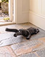 The Black Dog and Bone Boot Jack Placed at the Entrance of a Rustic Cottage Porch - Digital Illustration 