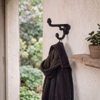 The Black Iron Priory Coat Hook Next to a Home Doorway with a Coat on it - Digital Illustration The Black Iron Priory Coat Hook Next to a Home Doorway with a Coat on it - Digital Illustration