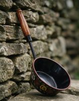 The Black Traditional Narrowboat Dipper Leant Against a Wall Outside - Digital Illustration 