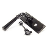 The Black Traditional Reeded Detail Bathroom Privacy Lock Handle Set Shown on its Side The Black Traditional Reeded Detail Bathroom Privacy Lock Handle Set Shown on its Side