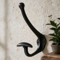 The Black Waxed Hook With Wide Coat Holder Fitted on a Wall in a Modern Interior Setting - Digital Illustration The Black Waxed Hook With Wide Coat Holder Fitted on a Wall in a Modern Interior Setting - Digital Illustration