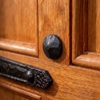 The Blacksmith Door Stud shown Mounted on a Heavy Timber Door - Digital Illustration 