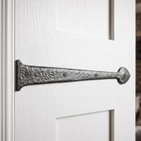 The Blacksmith Inspired Iron Hinge Front Fitted onto the Front of a Bright White Internal Door to Create a Traditional Look - Digital Illustration 