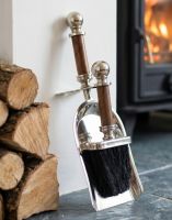 The “Brickhill House” Bright Chrome Brush & Pan Set next to a Stack of Logs by a Fireplace - Digital Illustration The “Brickhill House” Bright Chrome Brush & Pan Set next to a Stack of Logs by a Fireplace - Digital Illustration