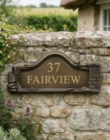 The Bronze Builders House Name Sign on a Rustic Garden Wall at the Front of a House - Digital Illustration The Bronze Builders House Name Sign on a Rustic Garden Wall at the Front of a House - Digital Illustration