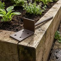 The Brown Railway Sleeper Concrete-In Base Anchor on the Edge of a Raised Sleeper Bed - Digital Illustration