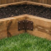 The Brown Railway Sleeper Internal Corner Support Bracket in a Garden on a Raised Flower Bed - Digital Illustration The Brown Railway Sleeper Internal Corner Support Bracket in a Garden on a Raised Flower Bed - Digital Illustration