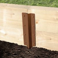 The Brown Railway Sleeper Straight Inline Spikes - Double on a White Background a Wooden Railway Sleeper Garden Planter