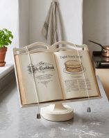 The Cast Iron Cook Book Stand in Cream Holding an Open Recipe Book in a Kitchen - Digital Illustration The Cast Iron Cook Book Stand in Cream Holding an Open Recipe Book in a Kitchen - Digital Illustration