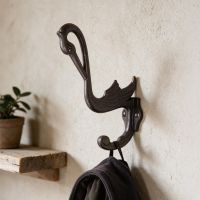 The Cast Iron Swan Design Cast Iron Hook on a Cream Wall in an Interior Setting - Digital Illustration The Cast Iron Swan Design Cast Iron Hook on a Cream Wall in an Interior Setting - Digital Illustration