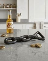 The Chain Bottle Opener on a Marble Effect Kitchen Countertop - Digital Illustration The Chain Bottle Opener on a Marble Effect Kitchen Countertop - Digital Illustration