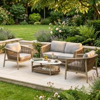 The Champagne "Chester" 4-Seater Outdoor Furniture Set on a Marble Patio Surrounded by Plants with the Table Layed with Drinks- Digital Illustration