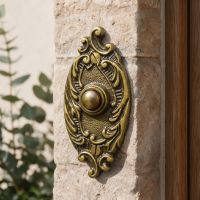 The Clarice Oval Antique Brass Ornate Bell Push next to a Modern Wooden Door on a Stone Brick Wall - Digital Illustration The Clarice Oval Antique Brass Ornate Bell Push next to a Modern Wooden Door on a Stone Brick Wall - Digital Illustration