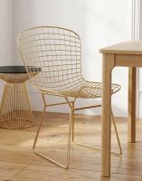 The Contemporary Square Gold Chair next to a Dining Room Table in a Contemporary Home - Digital Illustration The Contemporary Square Gold Chair next to a Dining Room Table in a Contemporary Home - Digital Illustration