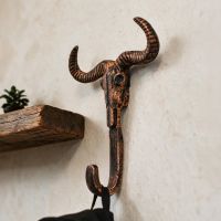 The Copper Longhorn Hook Mounted on a Wall next to a Shelf in a Modern Home - Digital Illustration The Copper Longhorn Hook Mounted on a Wall next to a Shelf in a Modern Home - Digital Illustration