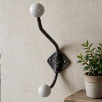 The Crackled Ceramic Tip Large Iron Coat Hook Fitted on an Interior wall next to a Shelf - Digital Illustration The Crackled Ceramic Tip Large Iron Coat Hook Fitted on an Interior wall next to a Shelf - Digital Illustration