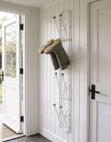 The Cream Brackenfell 4 Pair Wall Mounted Boot Rack Fixed to a Wooden Porch Wall- Digital Illustration 