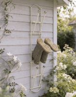 The Cream Lingfield Park 3 Pair Wall Mounted Boot Rack Mounted on a Wooden Exterior Wall - Digital Illustration The Cream Lingfield Park 3 Pair Wall Mounted Boot Rack Mounted on a Wooden Exterior Wall - Digital Illustration