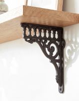 The Decorative 26 x 21cm "Ribbleshead" Classic Railway Bracket in Cast Iron Fixed to a Modern White Home Interior Supporting a Wooden Shelf - Digital Illustration The Decorative 26 x 21cm "Ribbleshead" Classic Railway Bracket in Cast Iron Fixed to a Modern White Home Interior Supporting a Wooden Shelf - Digital Illustration