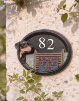 The Doberman Hand painted House Number Sign on a Pebble Wall in a Front Garden - Digital Illustration The Doberman Hand painted House Number Sign on a Pebble Wall in a Front Garden - Digital Illustration