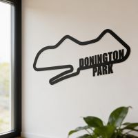 The Donington Park Motor Racing Circuit Black Steel Wall Art on a Magnolia Coloured Living Room Wall - Digital Illustration The Donington Park Motor Racing Circuit Black Steel Wall Art on a Magnolia Coloured Living Room Wall - Digital Illustration