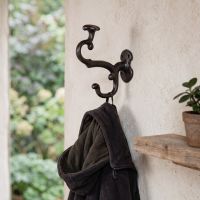 The Double Coat and Hat Hook Cast Iron Hook Shown on a Interior Wall in a Modern Home - Digital Illustration The Double Coat and Hat Hook Cast Iron Hook Shown on a Interior Wall in a Modern Home - Digital Illustration