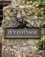 The Elf House Name Sign Mounted on a Stone Gate Post for a House Entrance - Digital Illustration The Elf House Name Sign Mounted on a Stone Gate Post for a House Entrance - Digital Illustration